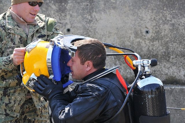 image of diver getting ready for underwater job