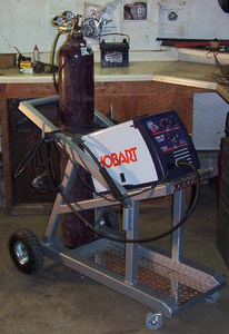 Welding machine and a welding gas cylinder on a welding cart