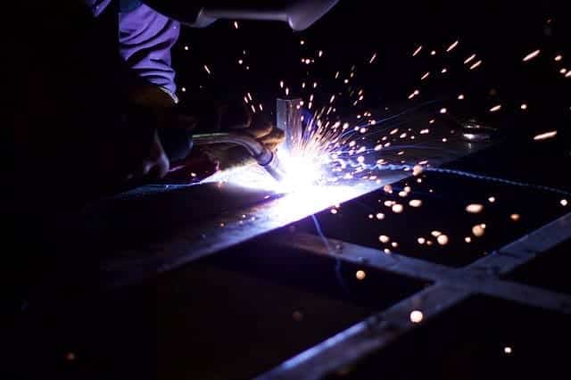 image of a welder doing a MIG weld on a sheet metal