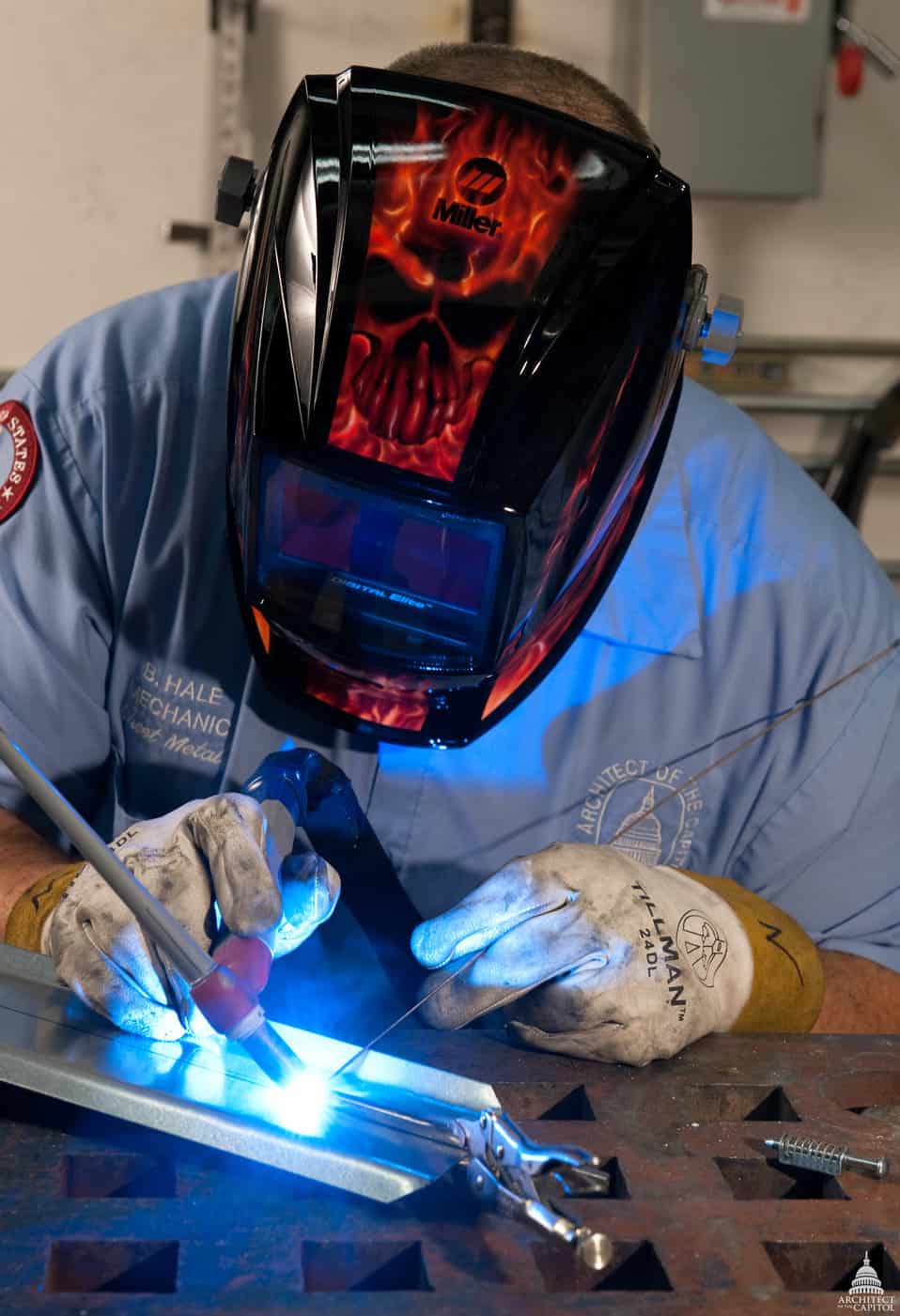 image of a welder doing a TIG weld on a sheet metal