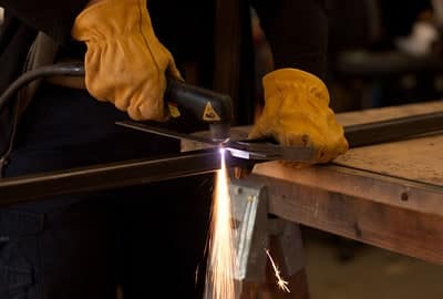 image of a worker cutting using plasma