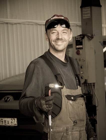 image of a mechanic with a plasma torch