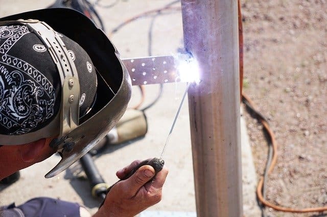 image of the worker making a stick weld