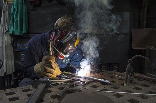 Image of a welder working with a stick welder