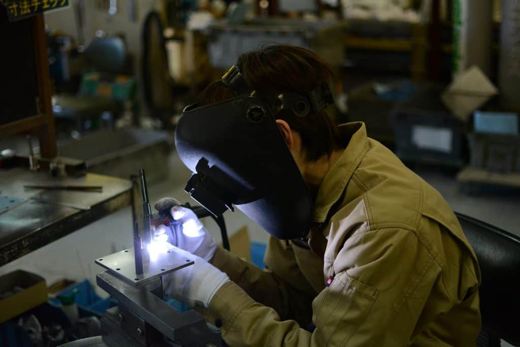 Image of a worker making a tig weld