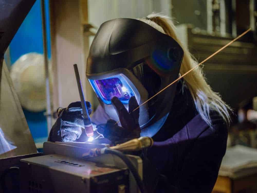 Woman using multi process welder