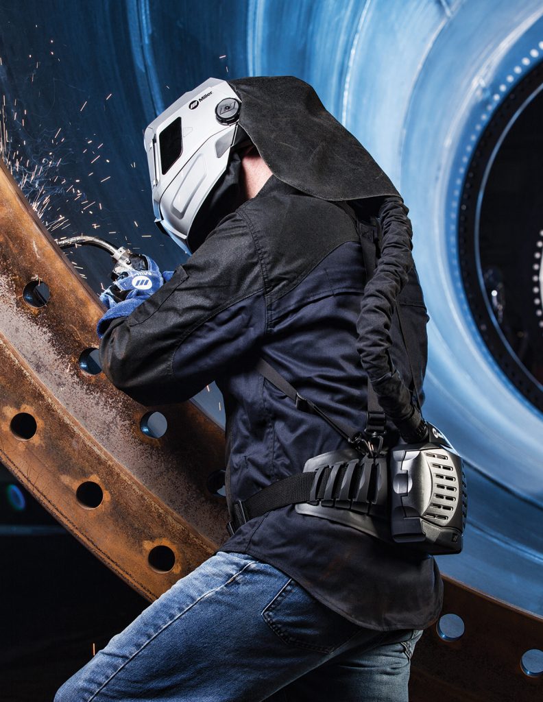 Welder welding with MIG, and using Miller PAPR welding helmet