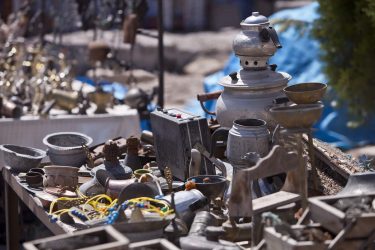 image of table with pot metal trinkets