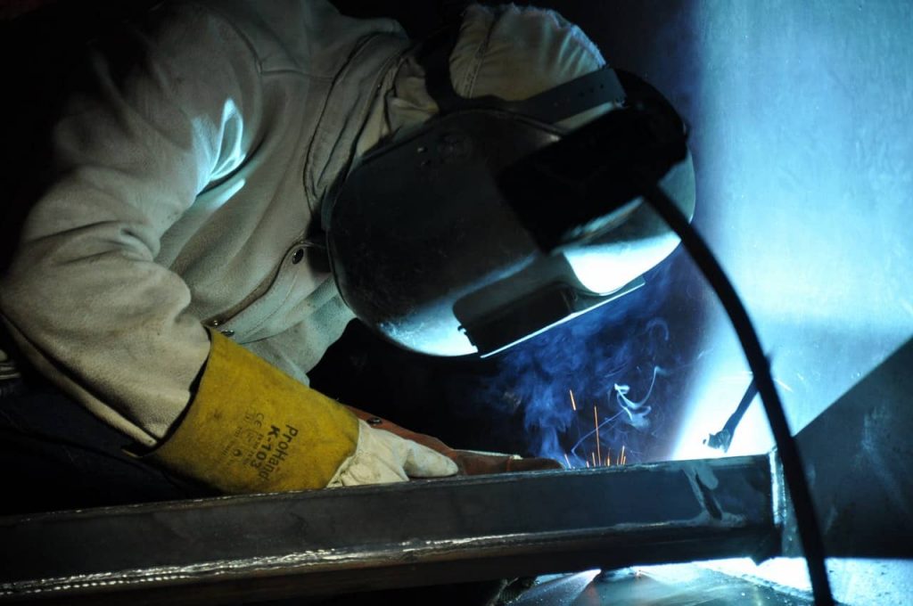 image of a welder in proper safety clothing