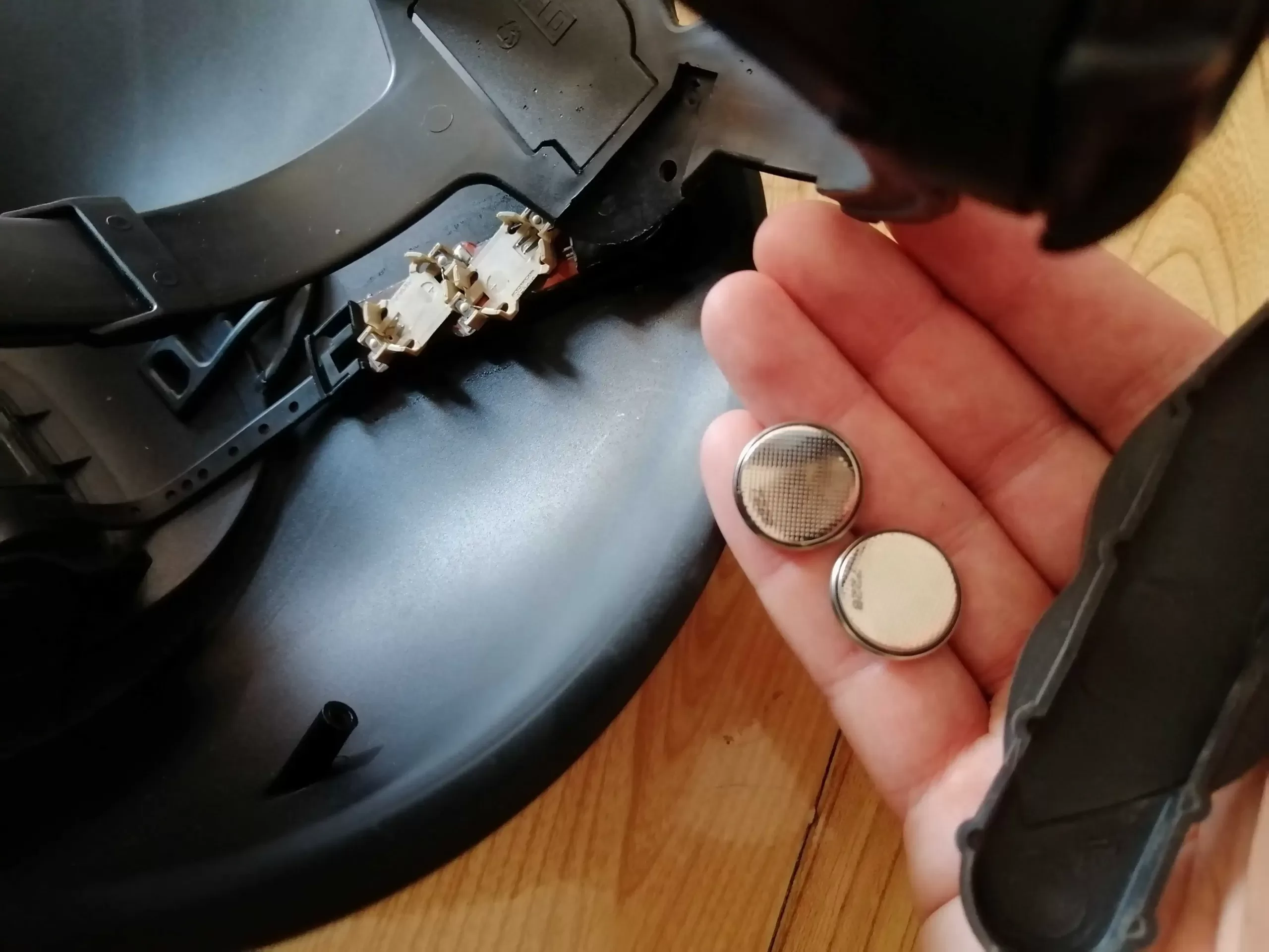 Removing the batteries from the welding helmet before cleaning it