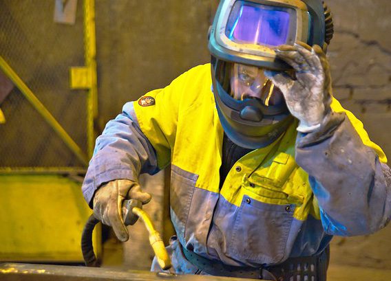 image of a man wearing a welding helmet