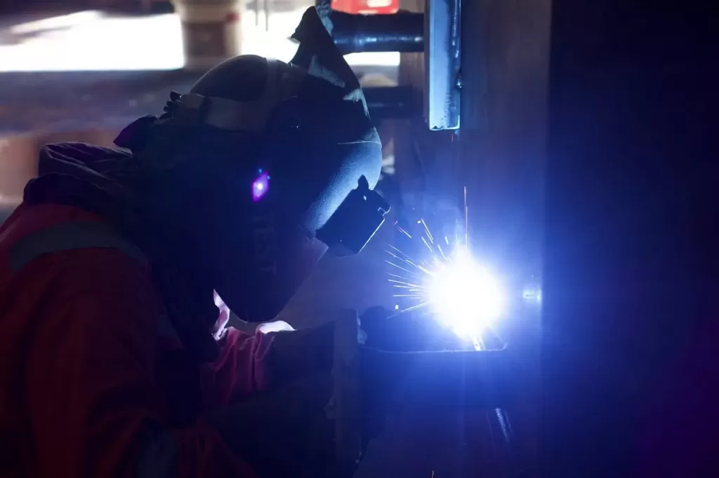 image of a welder using a helmet