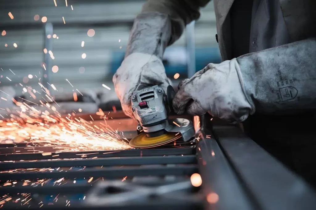 image of a worker using a grinder