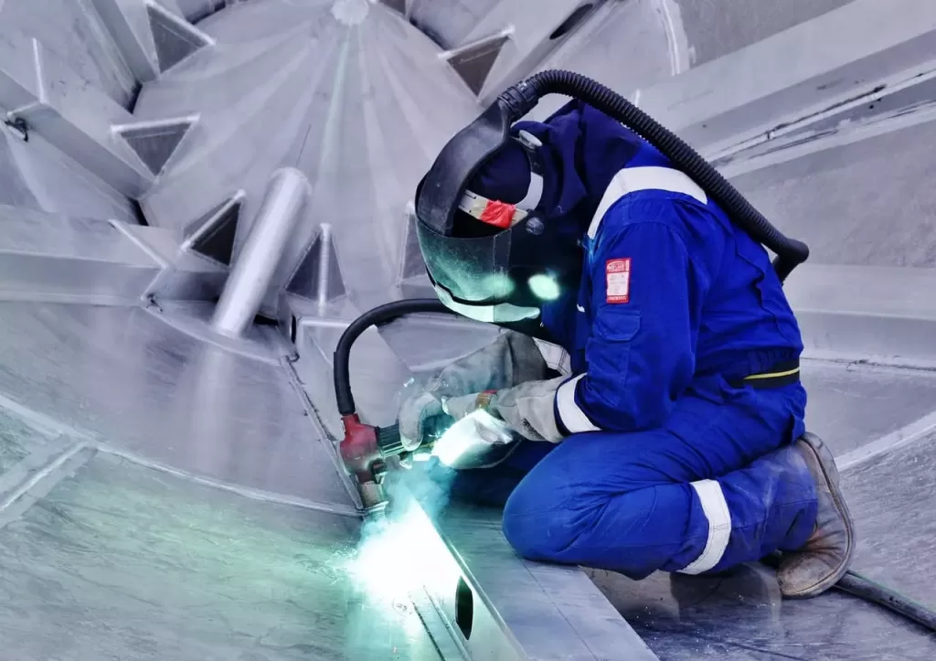image of a welder working with Zinc metal