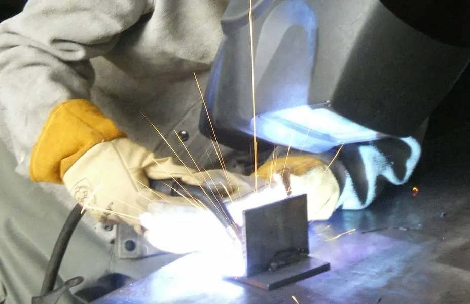 image of a welder in full protection equipment