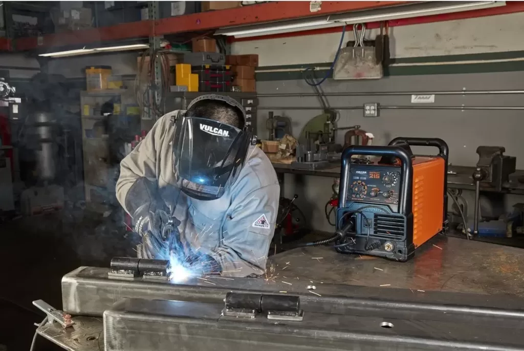 image of welder welding with Vulcan migmax 215 welder