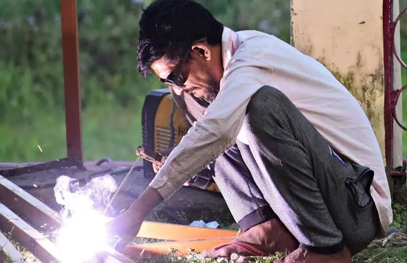 image of a welder using poor protection equipment