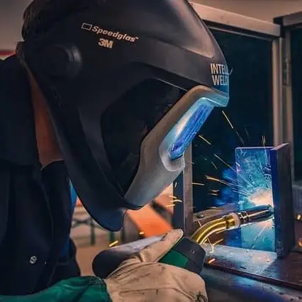 Welder using a speedglas welding helmet to pass the welding test 