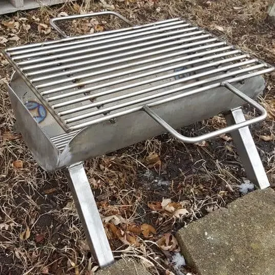 DIY BBQ Pit made from a stainless steel barrel's half 