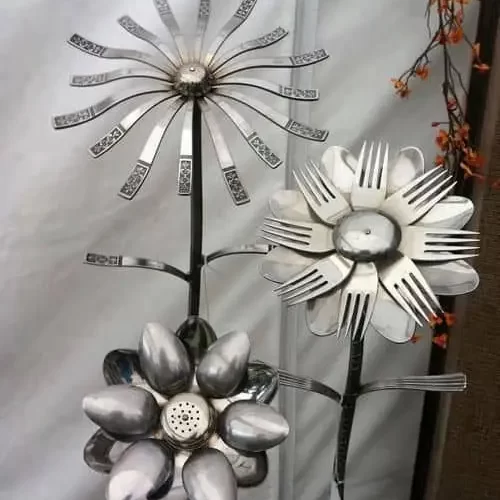 Metal art made from welded spoons in the shape of a flower 
