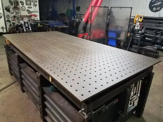 Image of a DIY metal table for welding shop with all the accessories beneath 