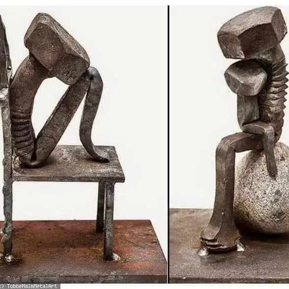 metal welded sculpture of a man sitting on a chair 