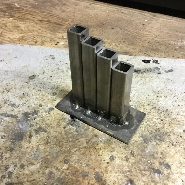 simple pencil holder made square tubes, and some iron welded together 