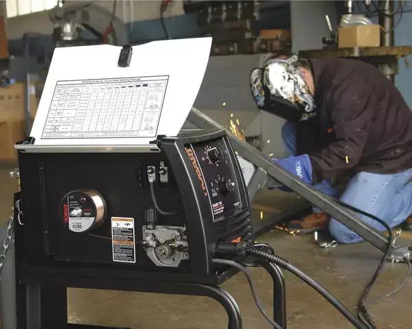 Welder using a MIG welder to weld titanium 