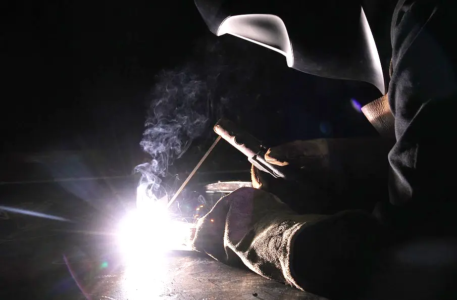 image of a welder doing stick welding