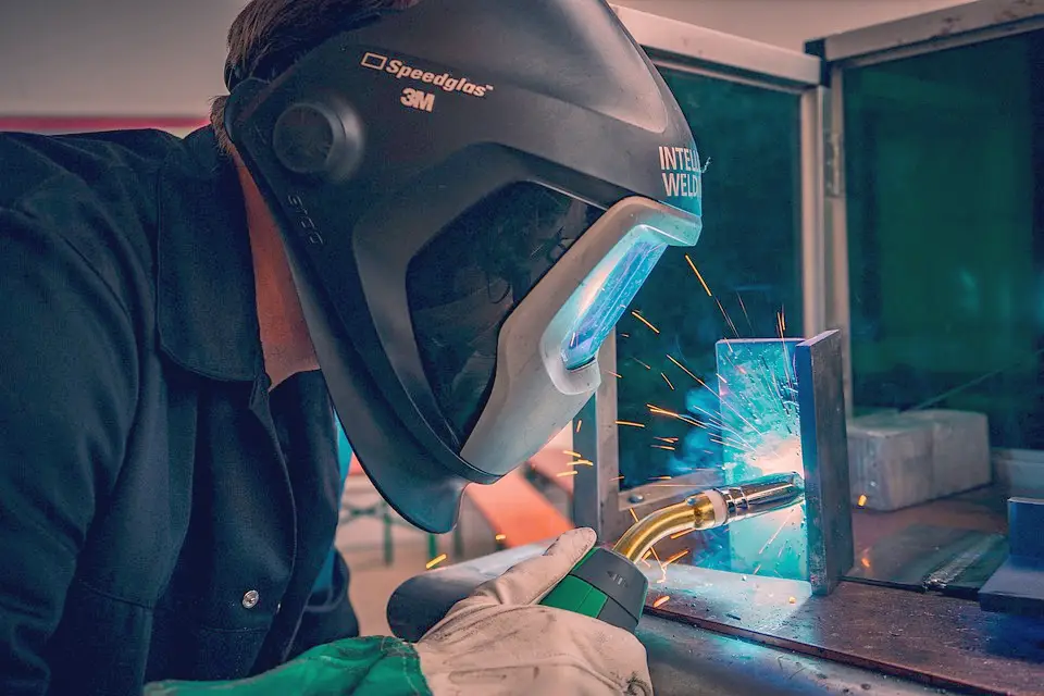 image of a worker laying a weld