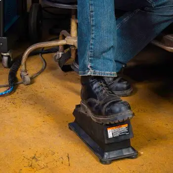 image of a welder using a foot pedal to imitate pulse welding 