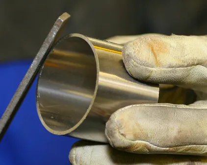 Using file to prepare and clean the stainless steel pipe for TIG welding