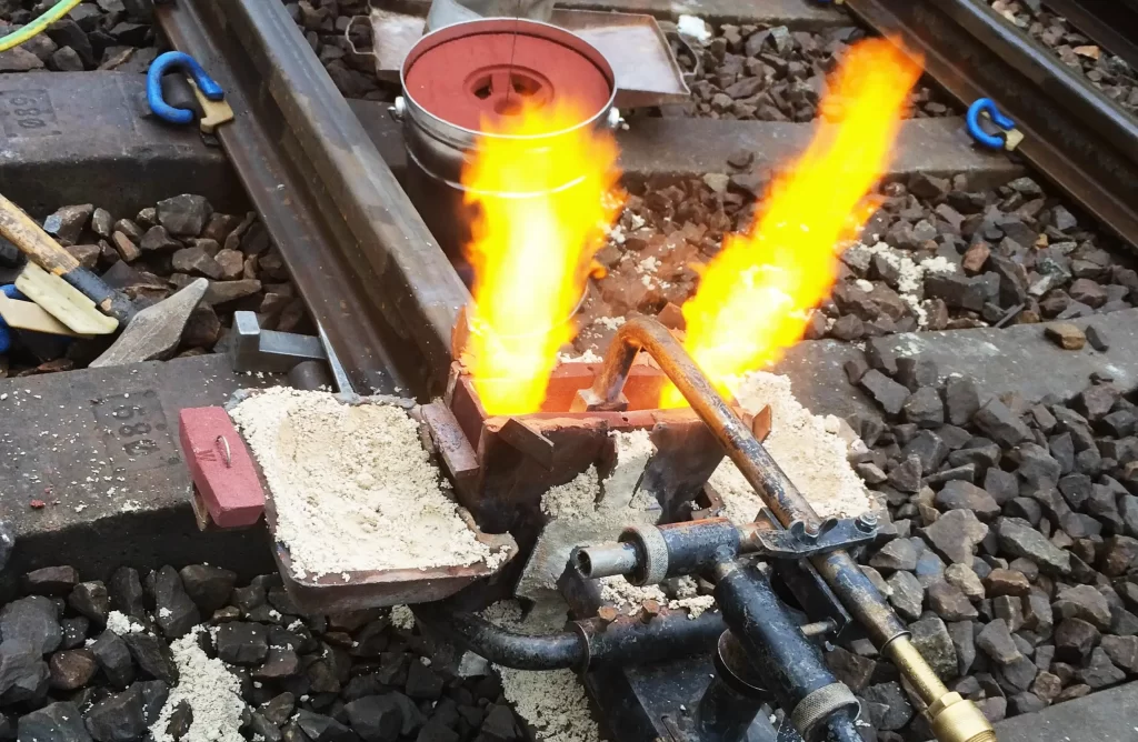 image showing preheating the rail before thermite welding