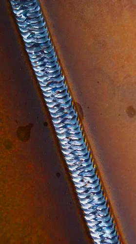 Vertical 3F Weld with MIG welding. uniformed zig-zazg beat by an experienced welder