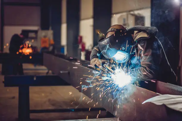 Image of MIG welding a steel pilar.