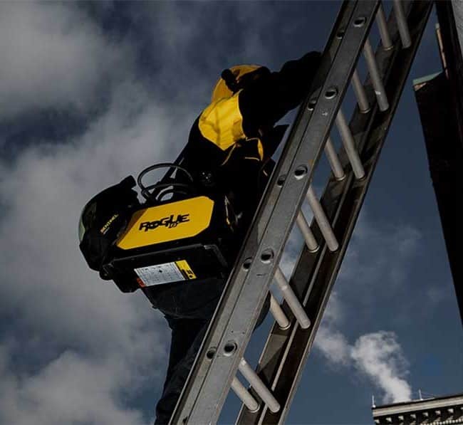 welder carrying welding machine around