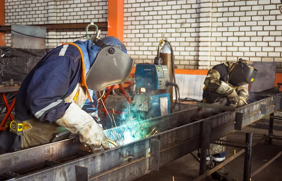 image of welders in the manufacturing plant