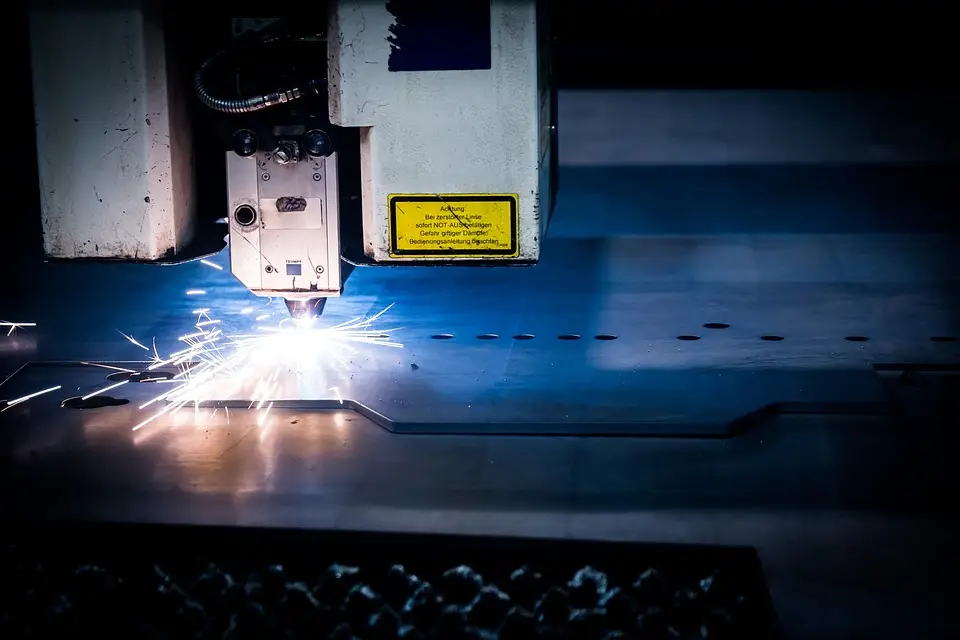 image of a CNC machine cutting a sheet metal