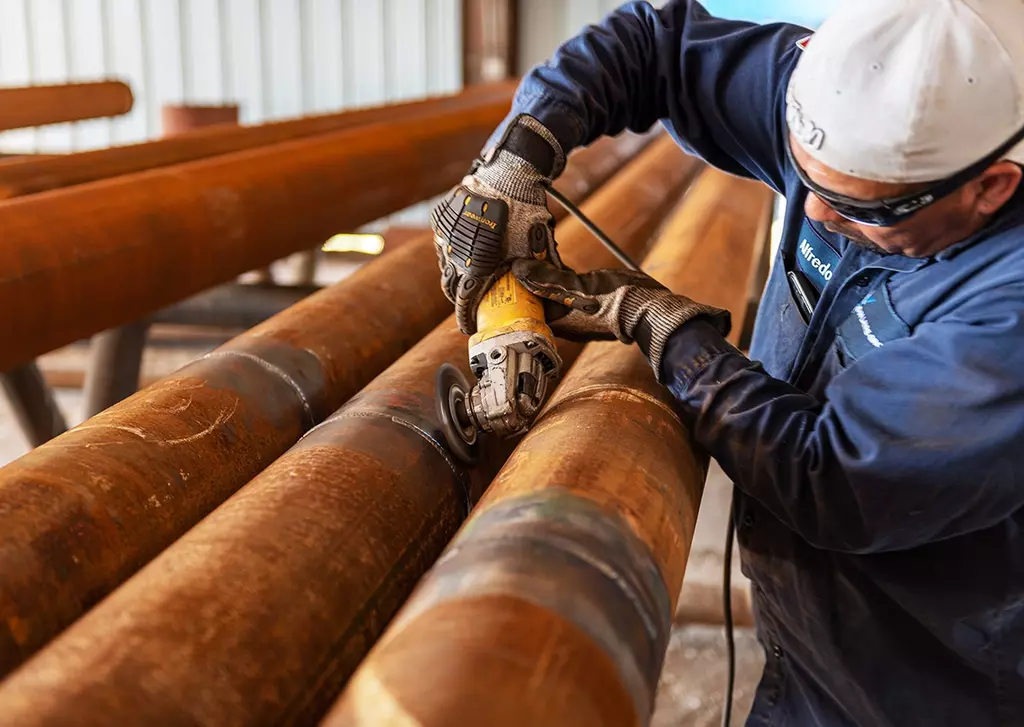 image of an operator testing weld joints for hardness