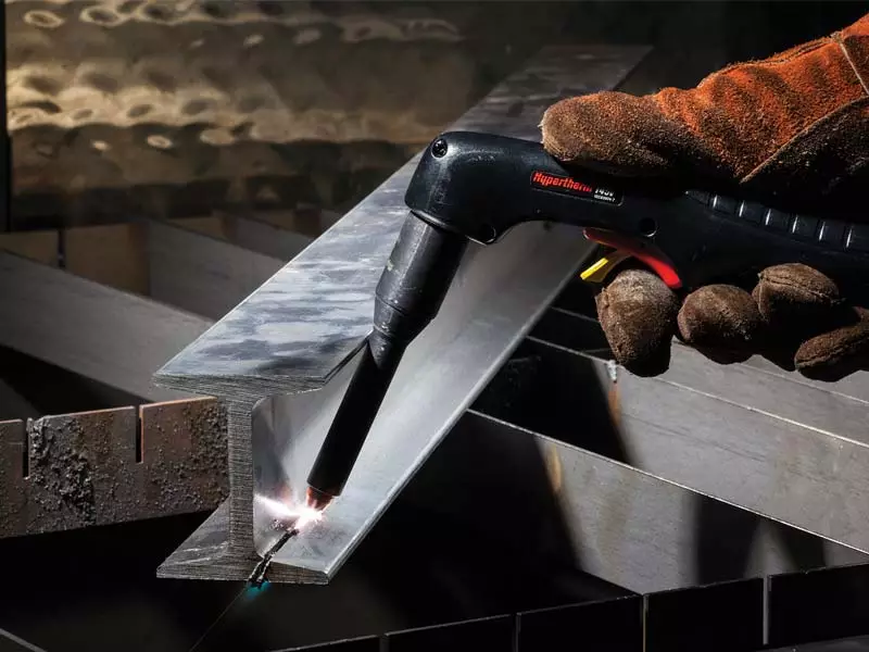 Image of plasma cutting a steel beam.