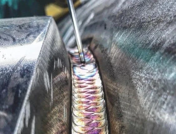 Image of a TIG welding root pass on a pipe
