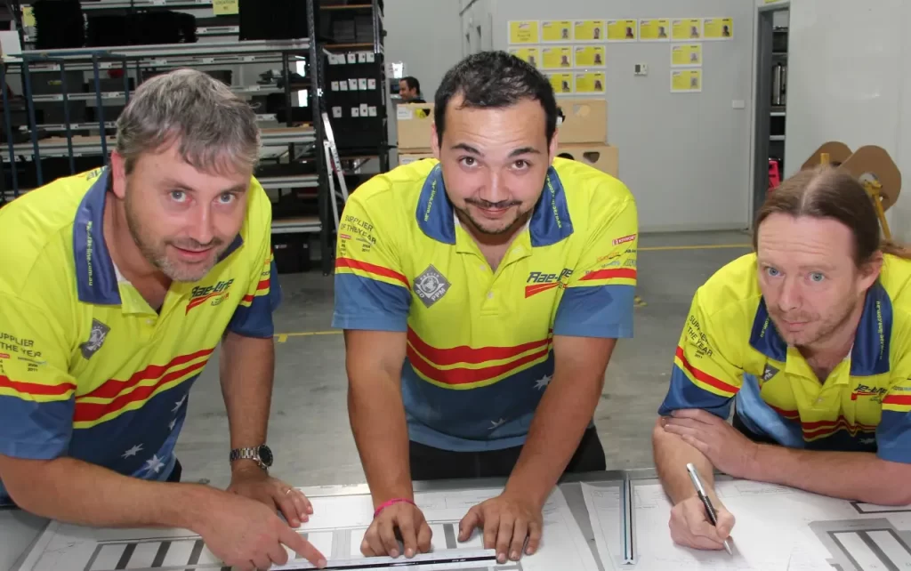 image of three employees discussing safety culture