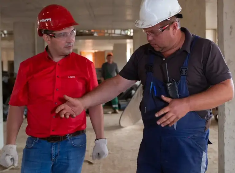image of two people discussing safety at work