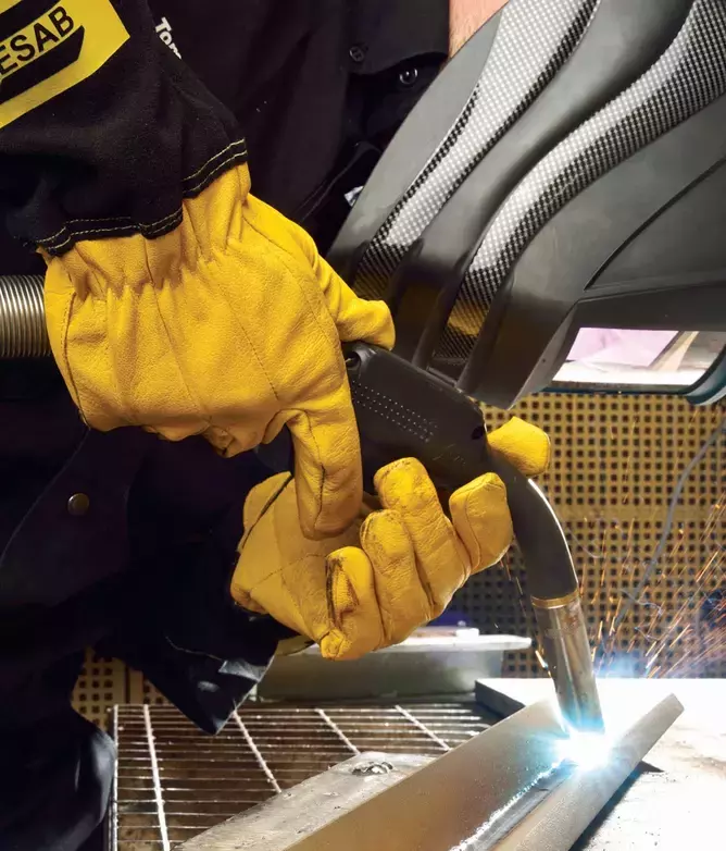 image of MIG welder using inert shielding gases to protect the weld