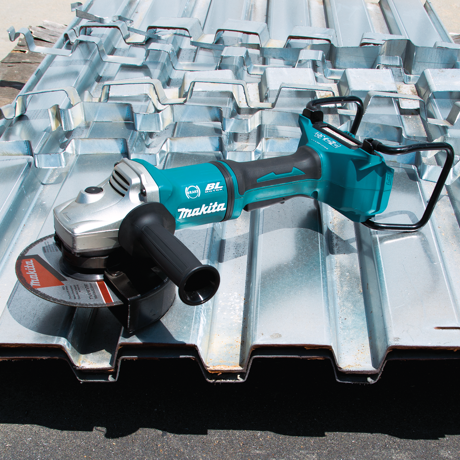 Makita XAG12Z1 grinder three-quarter view with battery roll cage